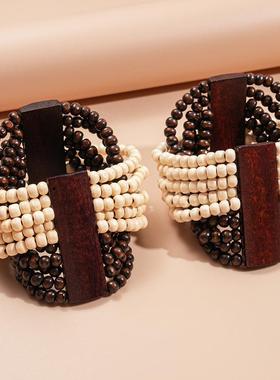 手链小木片高级编绳个性椰壳黑白众感手饰欧美撞色串珠女多层弹力