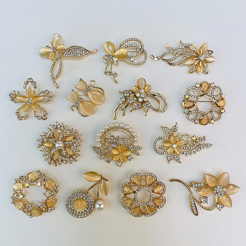 Korean high-end fashion rhinestone cat's eye orchid brooch corsage collar pin versatile clothing accessories scarf buckle wholesale