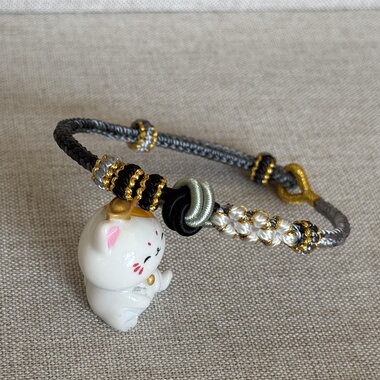 新款手工编织八股辫桃花结手绳可穿饰品吊坠情侣女手链酒窝结手绳