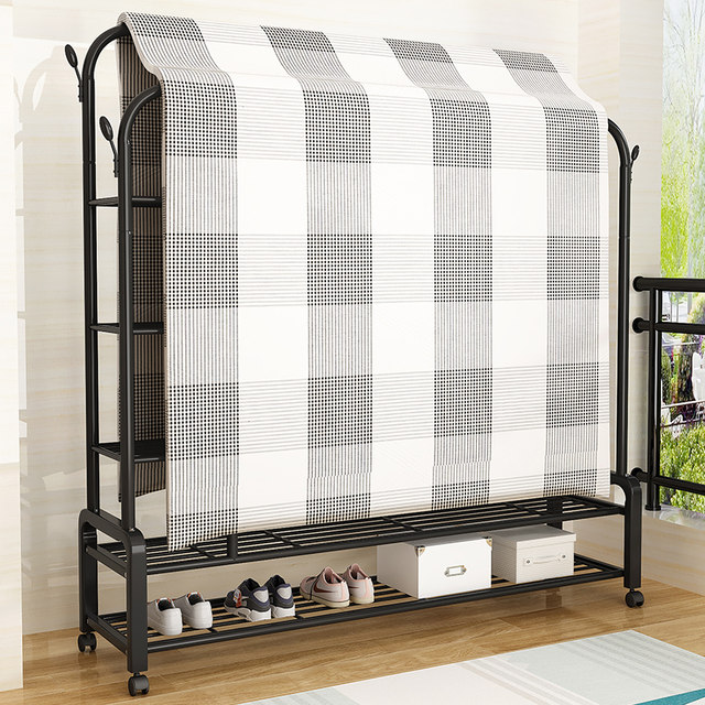 Floor-standing and removable clothes hanger