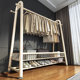 Floor-standing bedroom coat rack for home use
