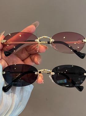 新款复古无边框椭圆黑色太阳镜