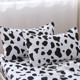 Modern and fashionable black and white cow spotted dog student bed sheets and quilt cover four-piece set cotton pure cotton bedding two persons