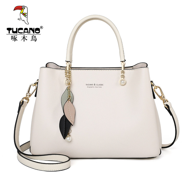 啄木鸟女士2021新款2022手提斜挎包 啄木鸟鑫星女士包袋