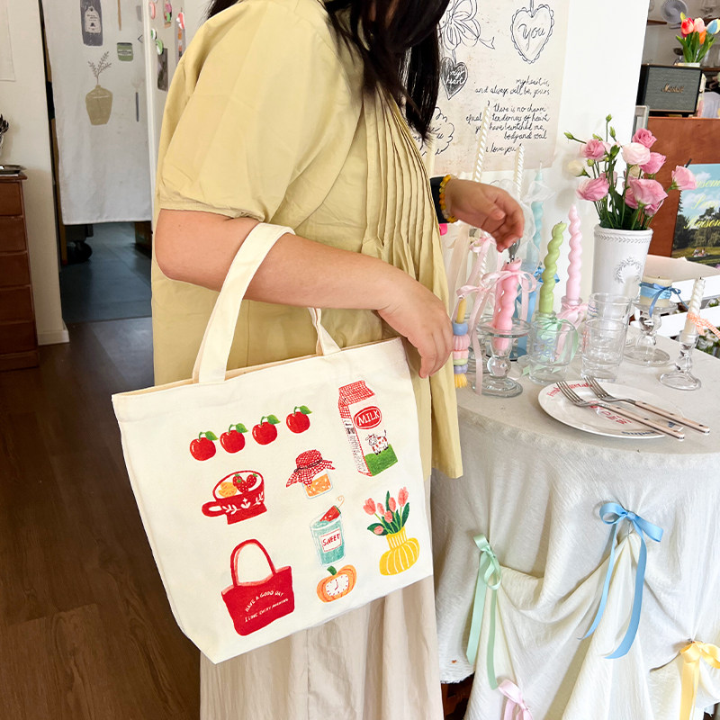 手提帆布包新款插画师联名学生通勤小拎包可爱饭盒袋百搭帆布袋,淘宝优惠券,粉丝福利购,淘宝优惠卷