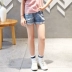 Navili 2019 hè mới cho bé gái quần jeans ngắn thời trang nước ngoài gas lỗ trẻ em quần hoang dã - Quần jean shop quần áo trẻ em Quần jean