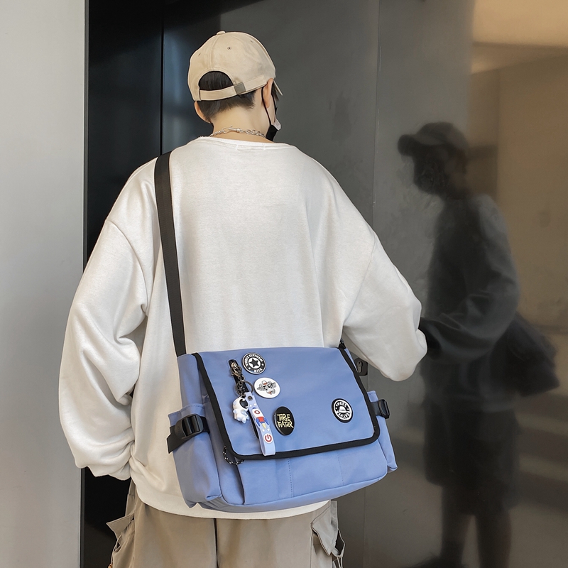 机能男休闲潮牌学生大容量女斜挎包 尼麦男士包袋