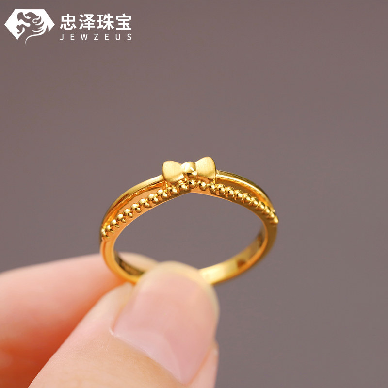 Small weight bow gold ring stacking ring