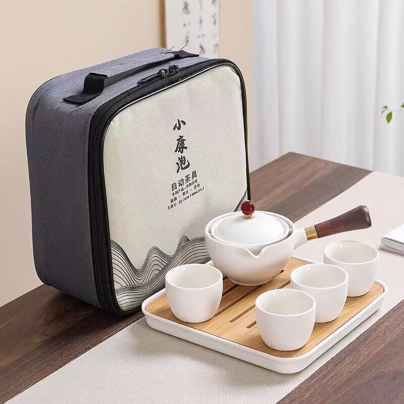 Portable travel tea set complete set of ceramic kung fu automatic rotating one pot four cups side handle tea maker