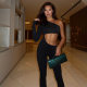 European and American style hot girl shows off her waist in black jumpsuit