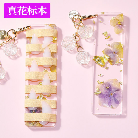 Le panneau de rangement pour ongles Guzheng avec de vrais spécimens de fleurs est unique.