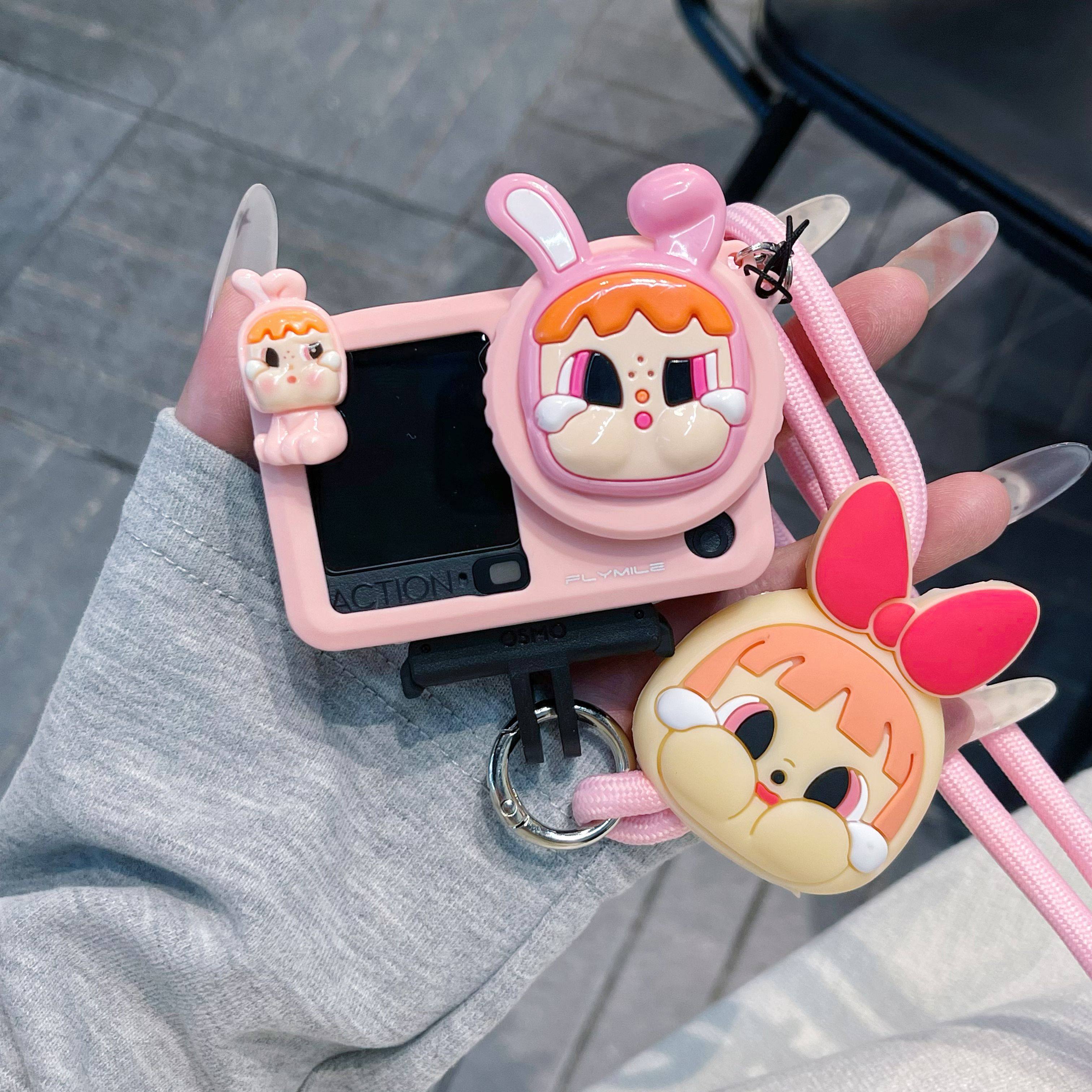 粉色哭娃适用新款大疆Action6运动相机保护套action5pro/4/3收纳盒防丢防刮相机保护套镜头盖防丢保护硅胶套,淘宝优惠券,粉丝福利购,淘宝优惠卷