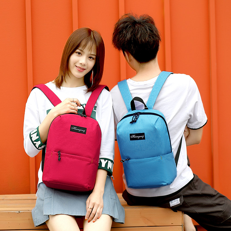 男女休闲轻便户外小学生超轻双肩包 纳兜箱包双肩背包