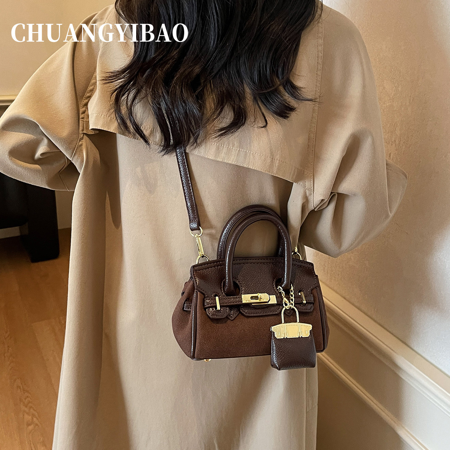 秋冬超火手提麂皮凯莉包包女2025新款轻奢小众高级感通勤斜挎小包,淘宝优惠券,粉丝福利购,淘宝优惠卷