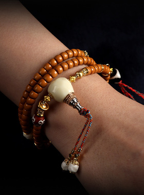 橄榄核尖手工精雕直切桶珠手串藏