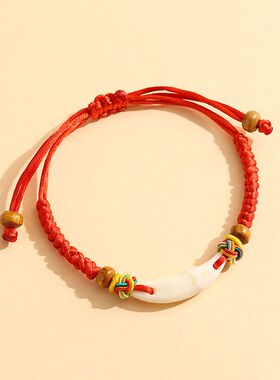 儿童宝宝狗牙红绳手链手工编织猪惊骨桃蓝桃核手绳批发