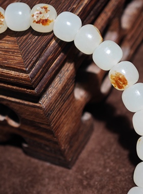 在售新疆和田玉籽料红皮白肉6*7mm老型珠单圈天然皮色保真手串润