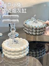 Light and luxurious ashtray with lid ceramic smoke Home living room Advanced sense creative personality upscale atmosphere anti-fly ash swing piece