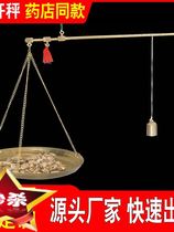 Old-style traditional Chinese medicine says Cscales medicine shop the same small copper scales medicinal herbs say the old pole says precision and small pole scale kitchen scales