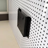 Perforated board computer screen stand saves space