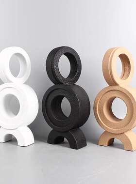 现代简约黑白树脂抽象人物雕塑摆件样板间客厅书房陀螺打结装饰品