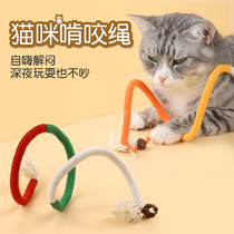 Cat toy kitty bites the rope toy self-hi demugling and grinding the tooth and the cat is teasing the cat stick supplies to nibble the toy rope.