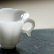 ແກະສະຫຼັກຈີນສີຂາວ jade porcelain ear-hanging tea cup handmade jade tea cup personal special cup single cup
