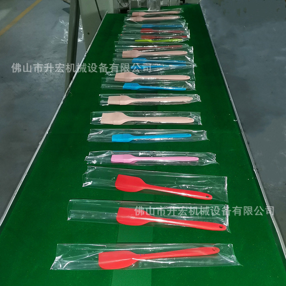 阳江硅胶锅厨具自动包装机 硅胶锅铲不粘锅油刷汤勺枕式包装机,淘宝优惠券,粉丝福利购,淘宝优惠卷