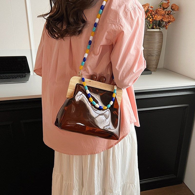 2024新款复古网红个性木头转锁链条夹口包时尚pu贝壳手提斜挎包潮,淘宝优惠券,粉丝福利购,淘宝优惠卷