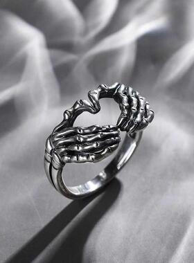 Retro skull hand with heart-shaped ring creative couple stai