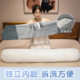 Bibi is a big doll sleeping on the bed with pillows