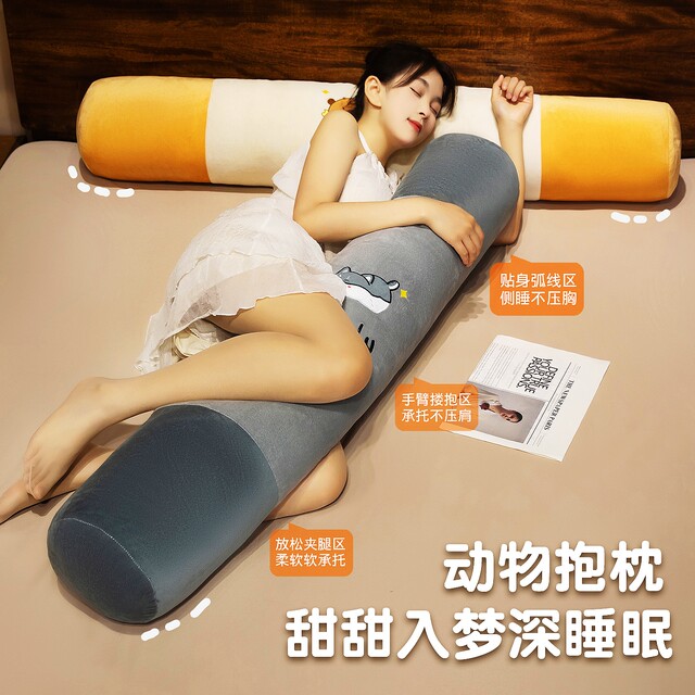 Bibi is a big doll sleeping on the bed with pillows
