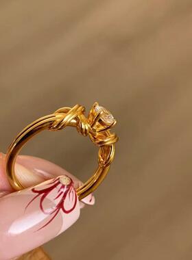 轻奢中古麻花线条交叉绳结镶钻戒指小众不规则复古金色绑带指环女