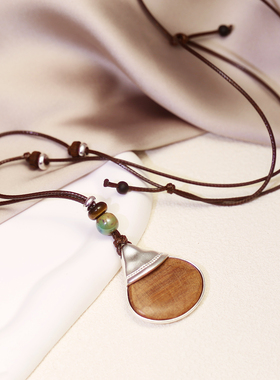 美拉德系手工皮绳高级长款毛衣链2025新款水滴木质吊坠秋冬项链
