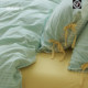 Her bedroom has a fresh spring and autumn mint green striped wash cotton cotton sheets and quilt covers bed four-piece set