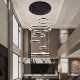 Large hollow staggered chandelier in the duplex building of the villa