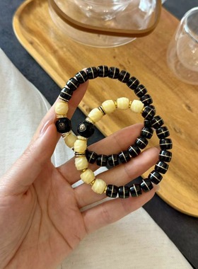 黑金镶铜丝椰蒂情侣手串，搭配驼骨无相桶珠，纯铜钻片、隔片等