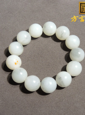 羊脂白玉挂金皮青花籽料