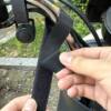 Electric vehicle charger hook thickened to prevent falling