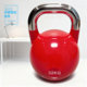 Competitive all-steel girls practice hip squats with solid kettlebells