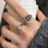 Niche cool retro oval hollow pattern cross ring for women new flower cross opening adjustable
