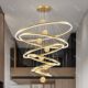Duplex building with large chandelier in empty living room villa
