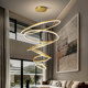 Duplex building with large chandelier in empty living room villa