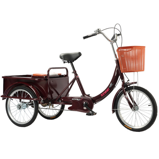 An old man buys groceries for leisure on his own on a tricycle