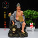 The resin statue of Jigong is enshrined in white marble