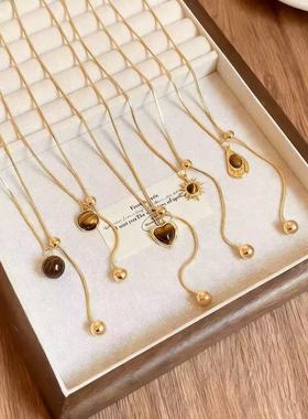 美拉德金色虎眼石吊坠项链女款高级感轻奢小众秋冬长款毛衣链配饰