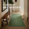Saipos gilded green wool bedside rug
