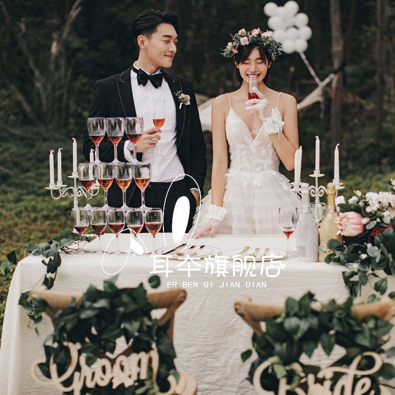 影楼摄影服装外情侣景草坪吊肩婚纱 耳夲婚纱