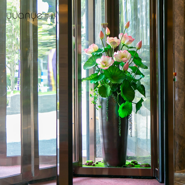 Hotel revolving door artificial flowers
