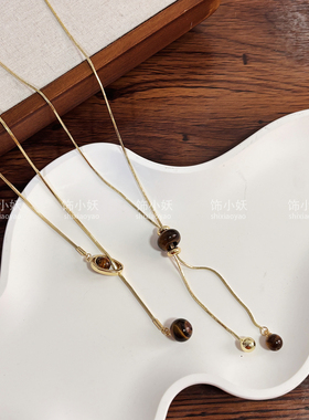 金色虎眼石抽拉毛衣链女款轻奢